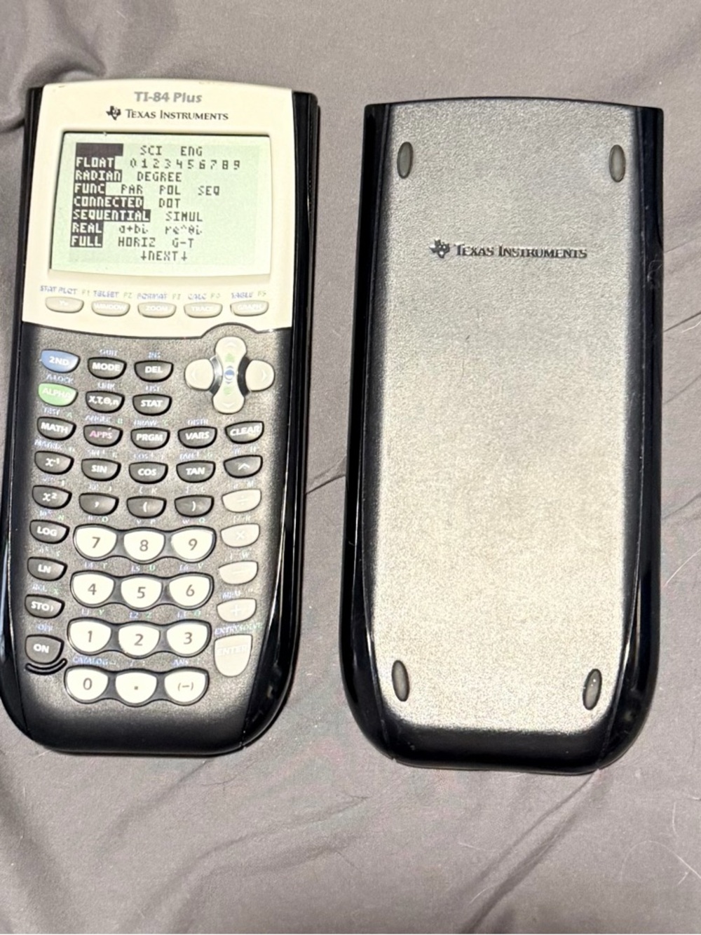 Texas Instruments TI-84 Plus Graphing Calculator - Black & Silver Cover